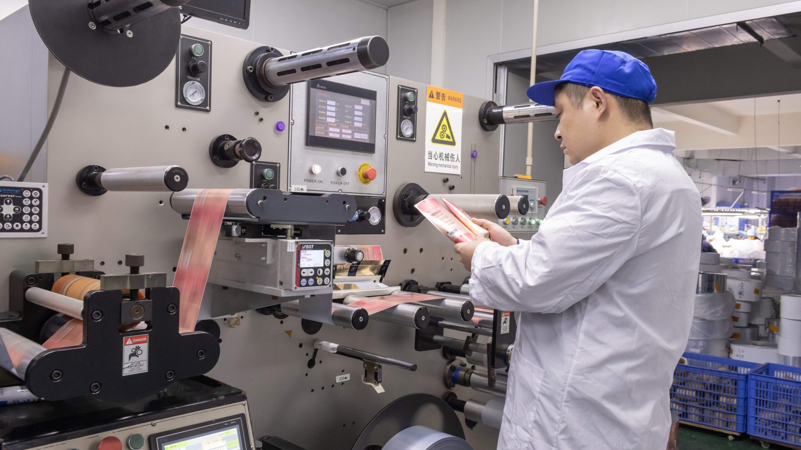 Packaging decoration processes line showing hot foil stamping and UV coating