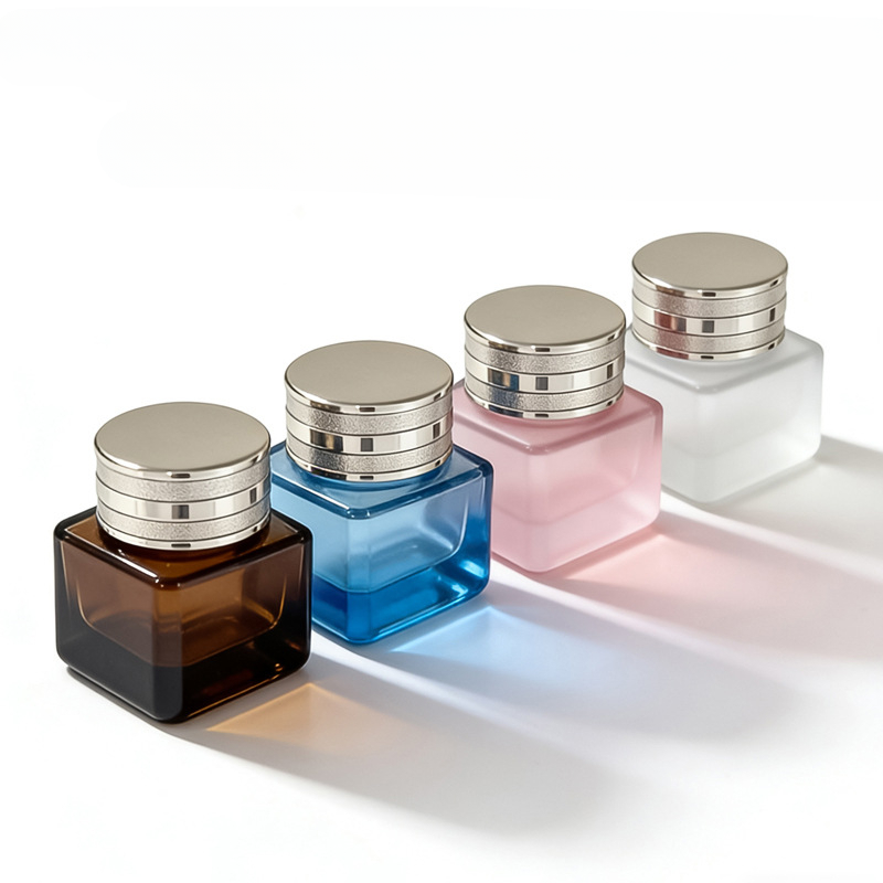 Square glass cosmetic jar with sharp lines and metallic lid